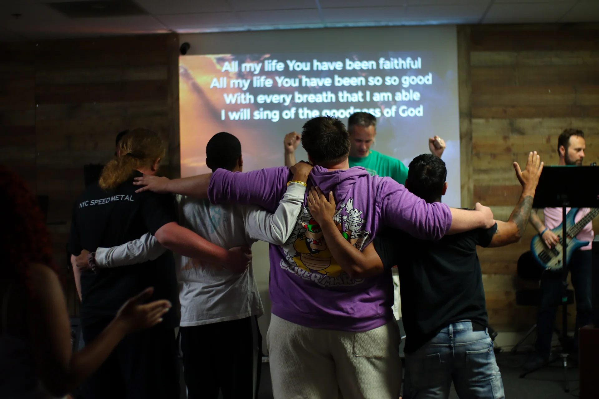 Members praying together at Matheteuo Ministries